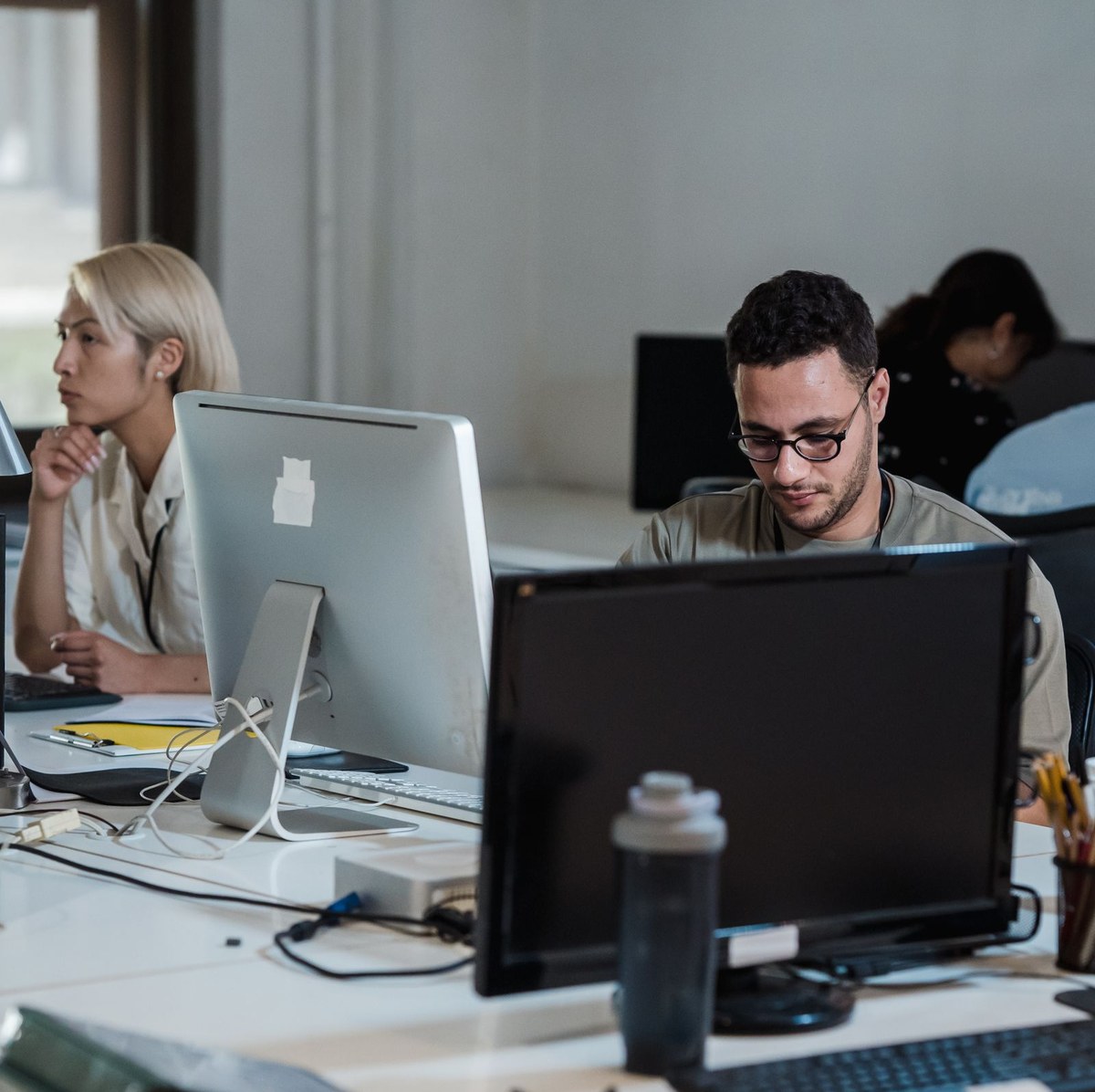 Developers in a light-filled workspace