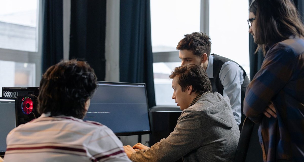 A software team reviewing work together